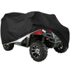 A black heavy-duty ATV cover is shown draped over a red and black off-road vehicle.