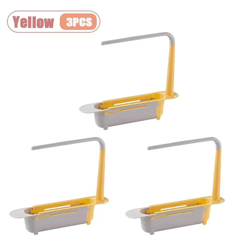 Three yellow adjustable over-sink dish rack organizers with gray holders.
