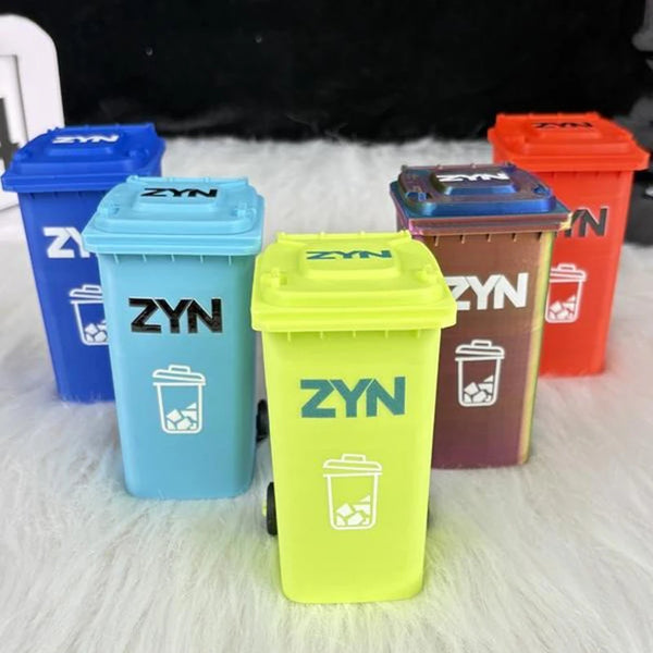 A collection of five mini desk organizer trash cans in various colors including blue, cyan, yellow, purple, and orange.