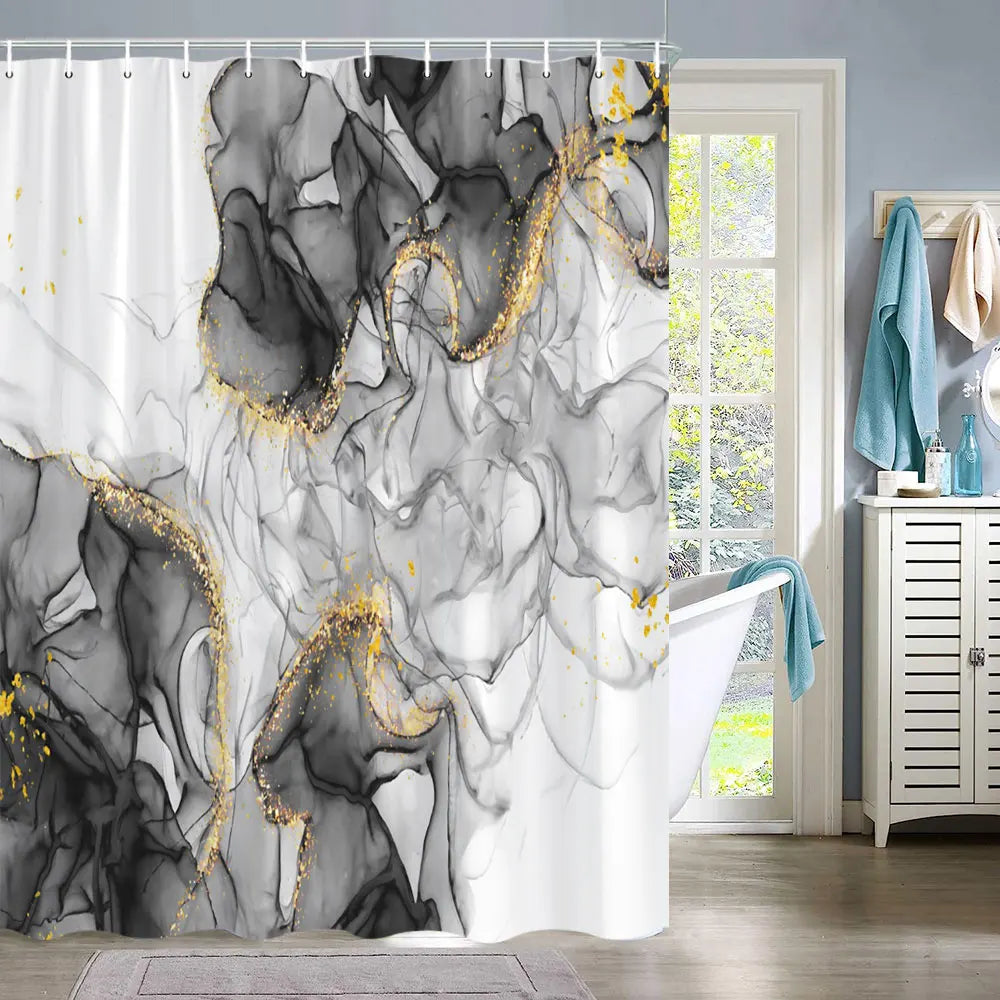 A shower curtain featuring an abstract marble texture in black and white with gold fluid accents.
