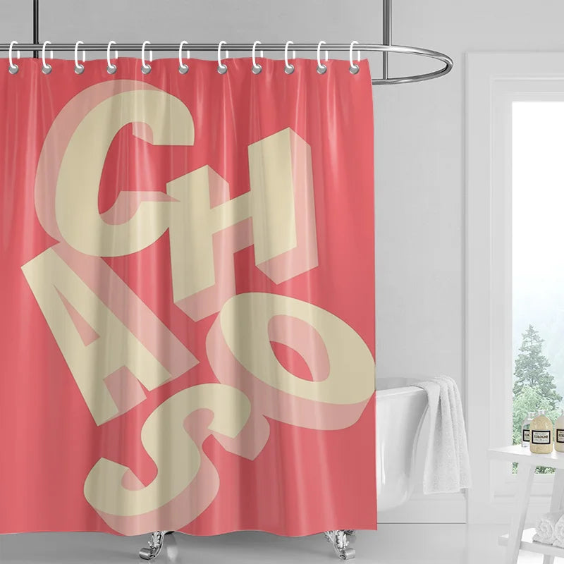 A pink shower curtain featuring large, light beige abstract geometric letters spelling out CHASOS.