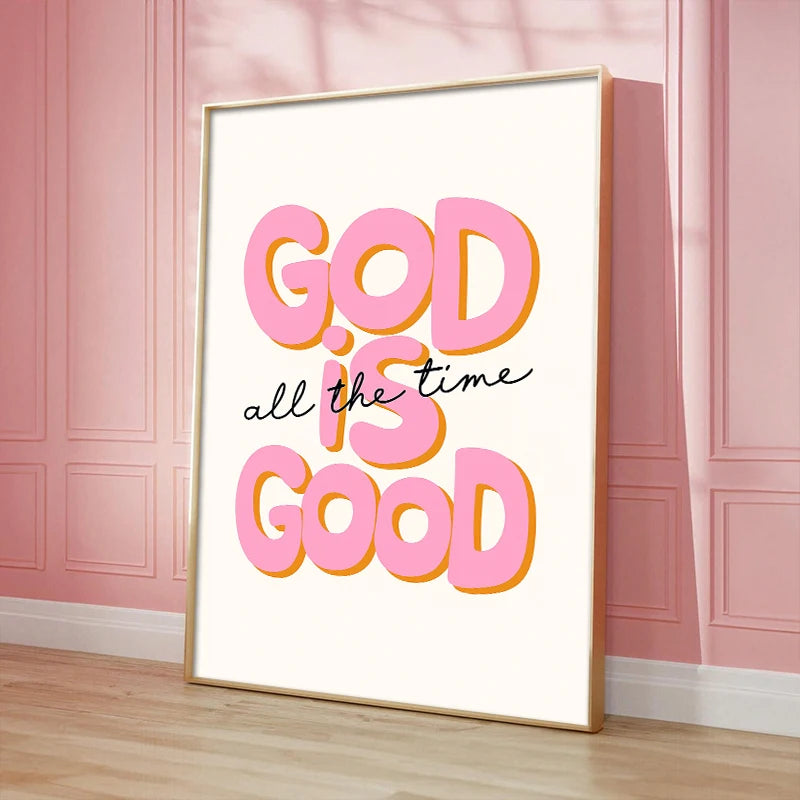 A framed canvas art print featuring the inspirational quote GOD is good in bright pink lettering on a white background.