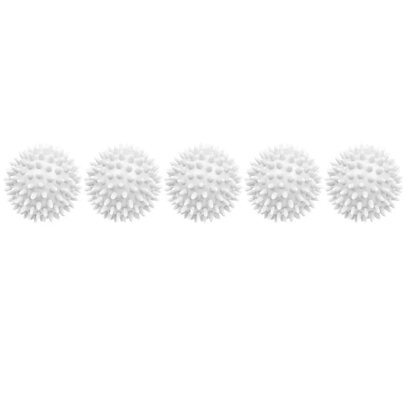 A row of white reusable laundry balls for clothes and machines.