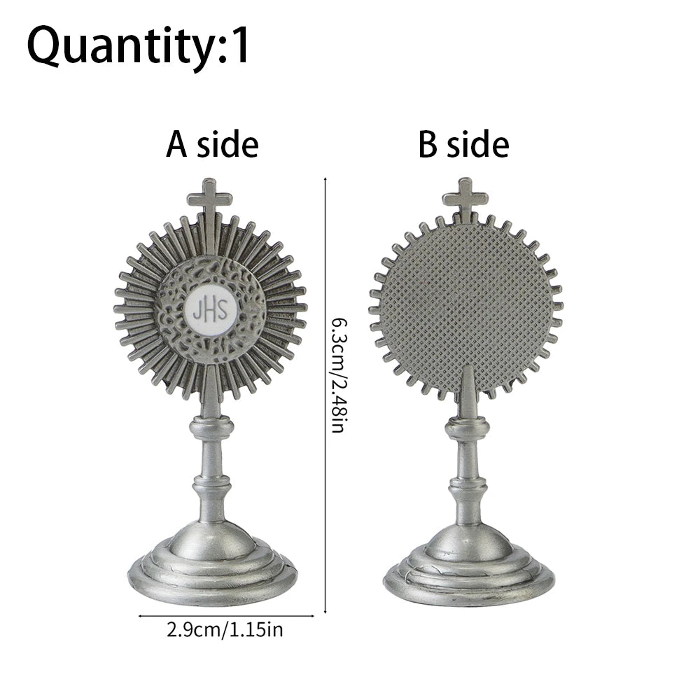 Two sides of a mini metal religious ornament featuring a cross and a circular design.