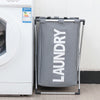 A gray foldable waterproof laundry basket hanging on a metal rack next to a white washing machine.