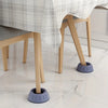 Anti-vibration feet for a wooden chair leg with a plaid fabric covering on a white marble floor