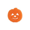 An orange, textured dish scrubbing sponge shaped like a carved pumpkin face.