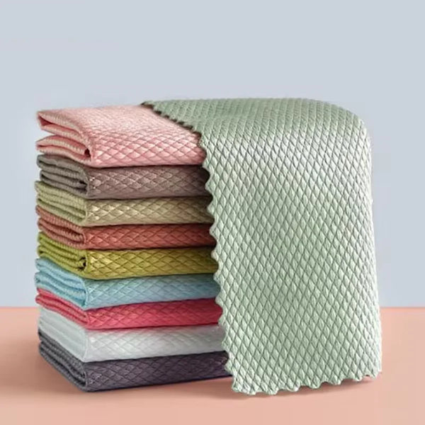 A stack of colorful reusable microfiber fish scale cleaning cloths in various shades of pink, green, and gray.