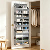 A white over-the-door hanging storage organizer with multiple compartments for household items.