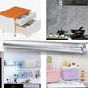 A silver self-adhesive aluminum foil kitchen wall sticker used as a waterproof and anti-oil backsplash protector.