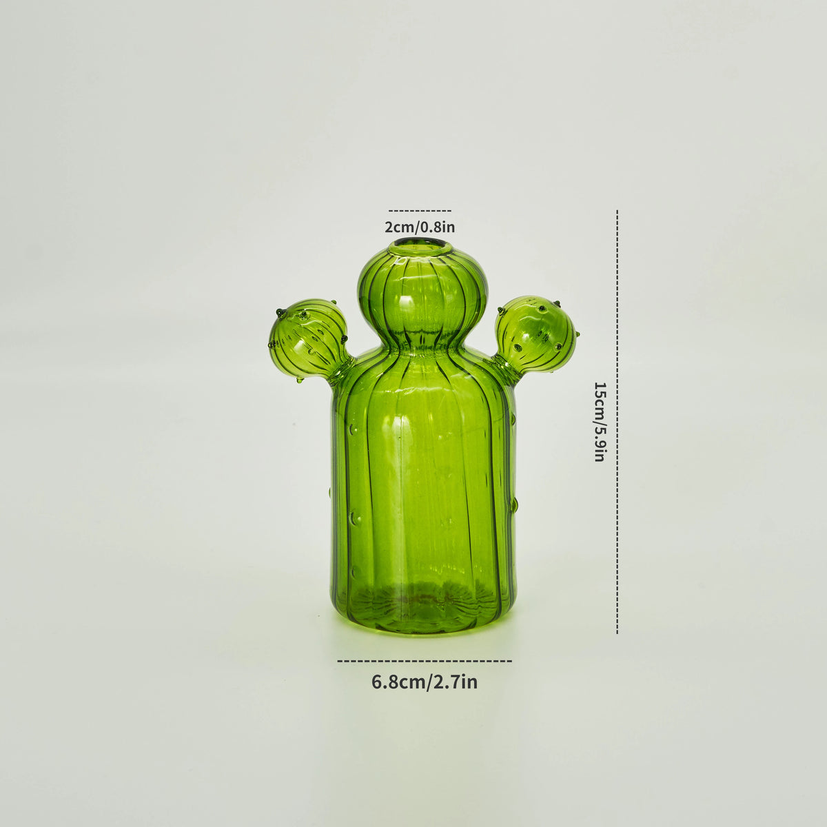 Un vase de cactus en verre vert moderne avec des protubérances sphériques sur le dessus et les côtés.