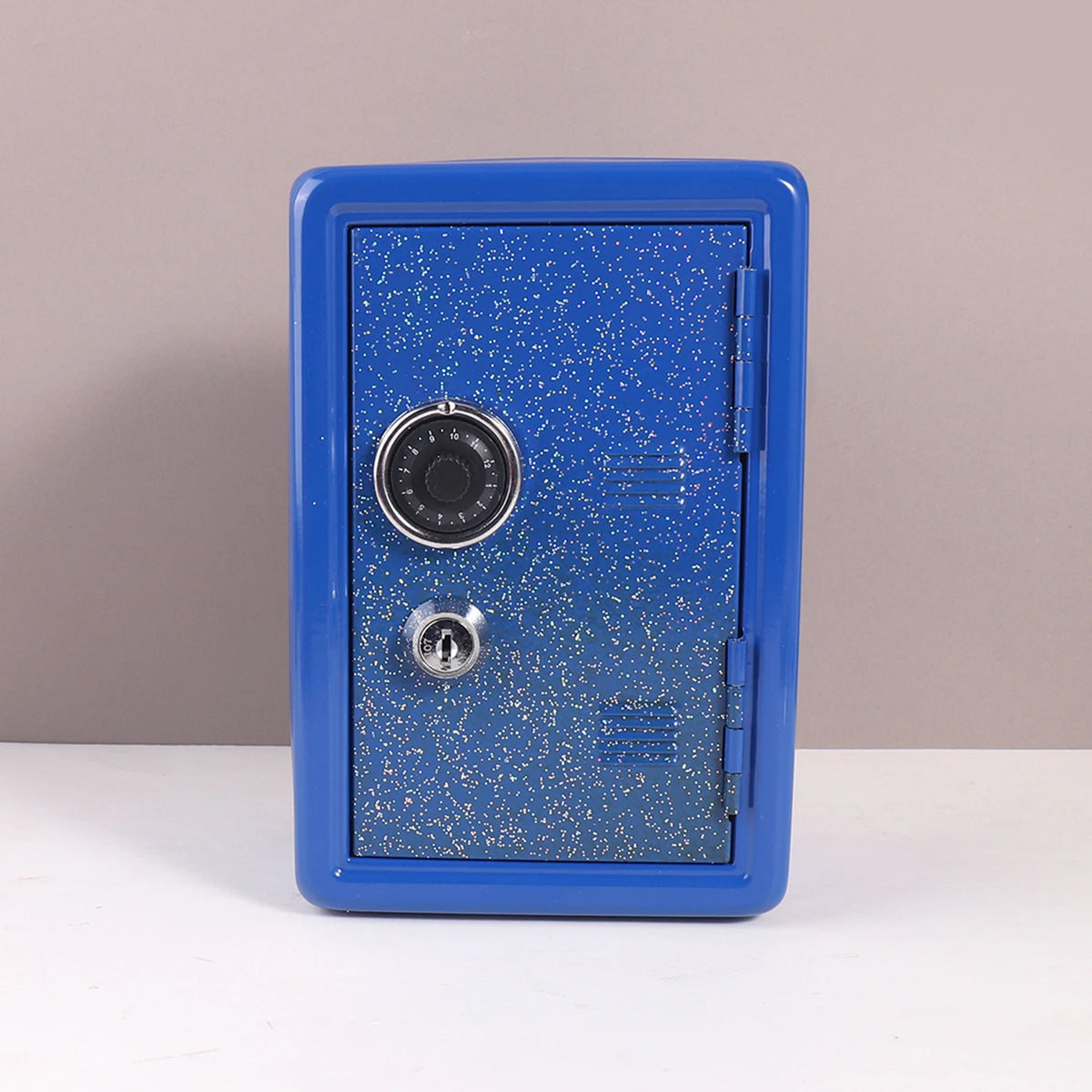A blue metal piggy bank with a combination lock is shown against a neutral background.