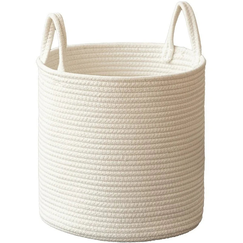A beige natural cotton rope storage basket with handles, showing a woven texture.