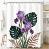 A shower curtain featuring a purple orchid and large green tropical leaves against a white background.