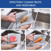 Hands place fruits and vegetables onto silver microfiber cleaning pads for washing.