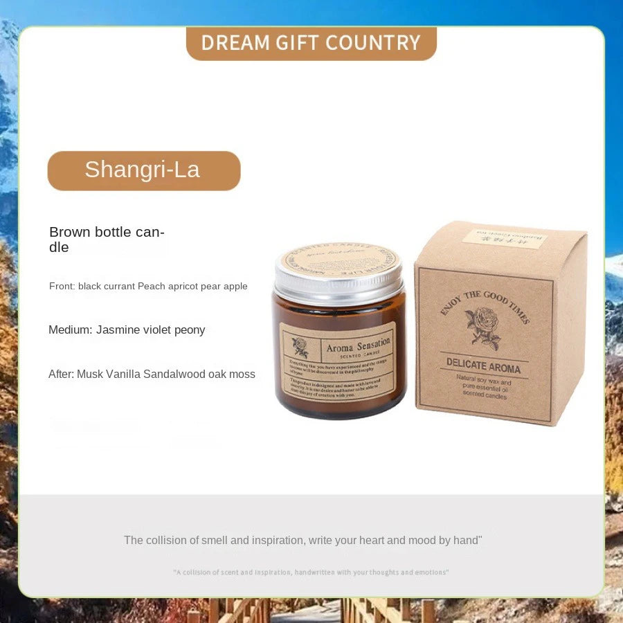 A brown glass candle jar labeled Aroma Sensation and a cardboard box for the Shangri-La dream gift country product