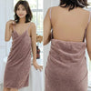 A woman models a mauve bath wrap towel draped over her body, shown from the front and back.