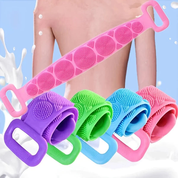 A pink silicone body scrubber brush is shown with various colored silicone exfoliating scrubbers in a white background.