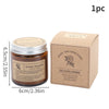 A brown glass jar of Aroma Sensation scented candle next to its kraft paper box.