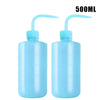 A pair of 500ml blue squeeze bottles with measurement marks for tattoo solutions.