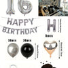 Un juego de globos con números en papel de aluminio plateado, una pancarta de cumpleaños y decoraciones de corazones de choco