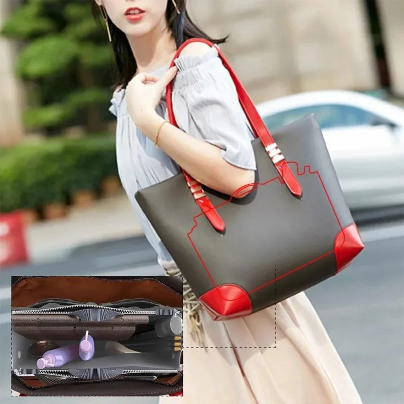 A woman holds a gray and red foldable cosmetic organizer pouch with a strap, next to an open brown leather case.
