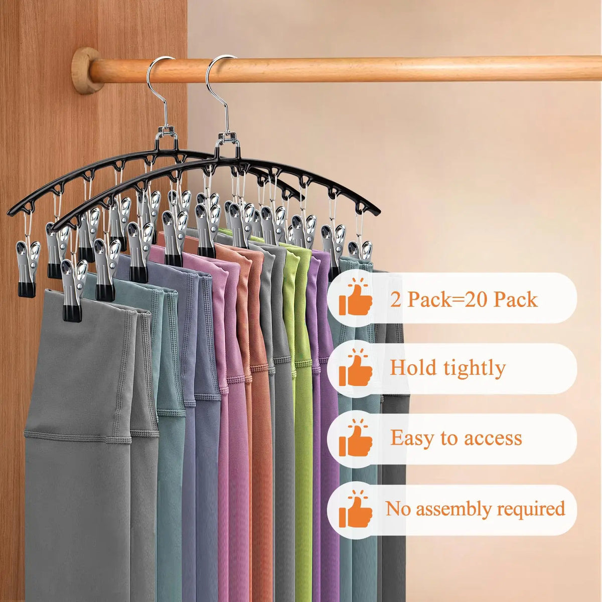 Estante de secado con perchas de acero inoxidable y organizador de múltiples clips mostrando camisetas de varios colores en u