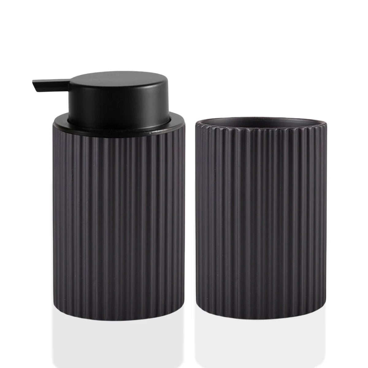 Black ceramic foaming soap dispenser with a pump top and a ribbed cylindrical body.