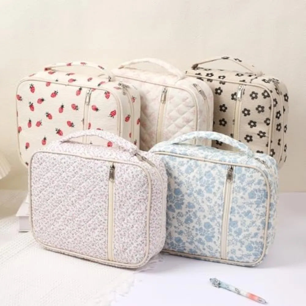 A set of four floral quilted Bible cover bags in cream and beige tones with zippers and handles.