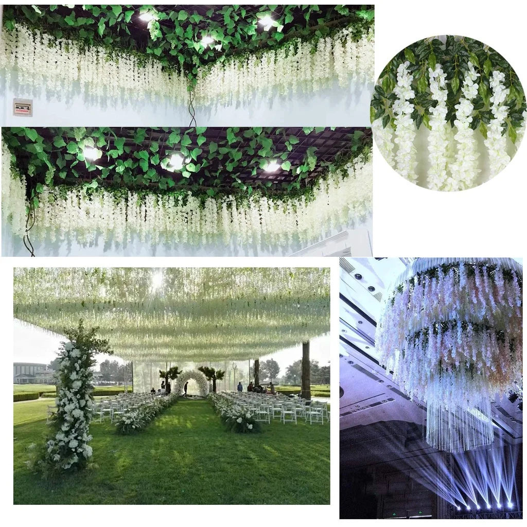 Close-up view of artificial wisteria garlands hanging from a ceiling, showcasing green leaves and white flowers.