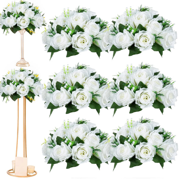 A collection of artificial white silk flower bouquets and arrangements for wedding decor.