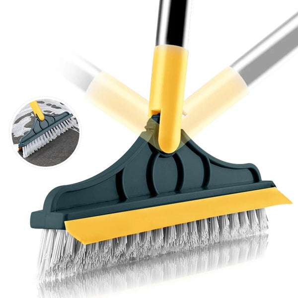 A yellow and dark gray 2-in-1 floor scrub brush being used to clean a surface.