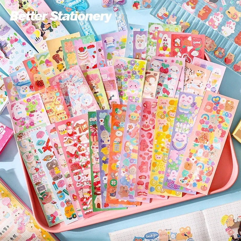 A colorful assortment of kawaii DIY sticker packs for crafting and decoration displayed in a pink tray.