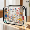 A clear acrylic cosmetic and storage pouch featuring a Paris France theme with Eiffel Tower and hot air balloons.