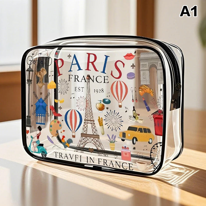 A clear acrylic cosmetic and storage pouch featuring a Paris France theme with Eiffel Tower and hot air balloons.