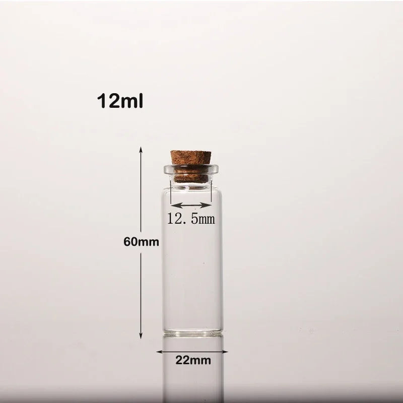 Flacon en verre transparent avec bouchon en liège, étiqueté 12ml et mesurant 60mm de hauteur.