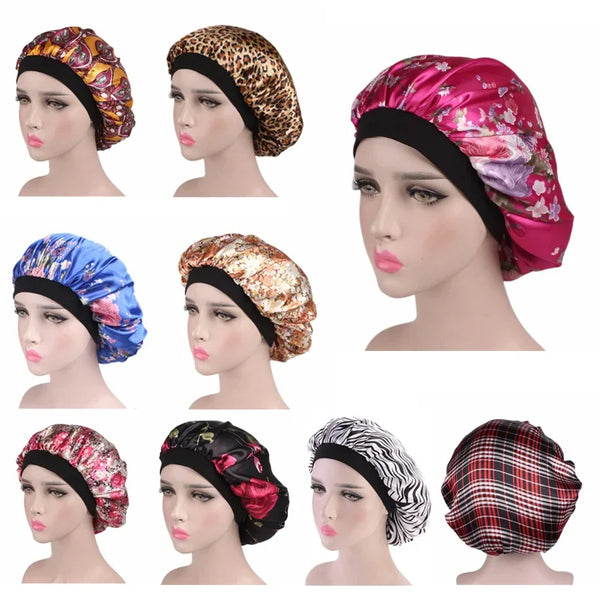 A collection of satin sleep bonnets in various floral, leopard print, and plaid patterns displayed on a mannequin head.