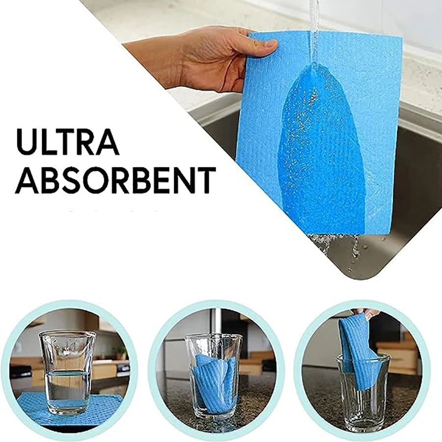 A hand is rinsing a bright blue ultra absorbent microfiber dish cloth under running water.