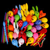 A collection of colorful inflatable cartoon animal balloons, including yellow, green, and red shapes.