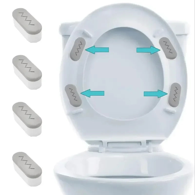 White toilet seat with protective pads visible inside the bowl area.