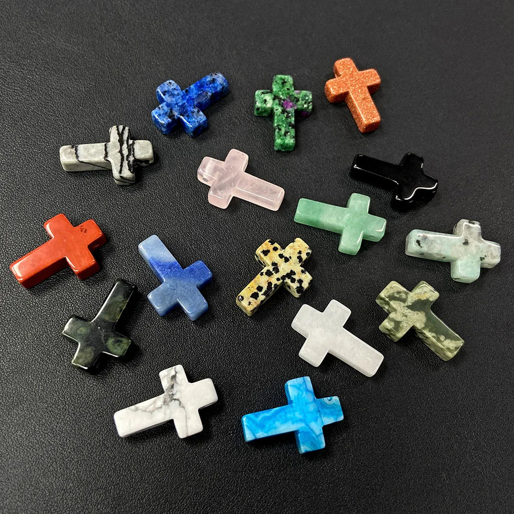 A collection of natural agate and jasper cross pendant charms in various colors including blue, green, orange, and black.