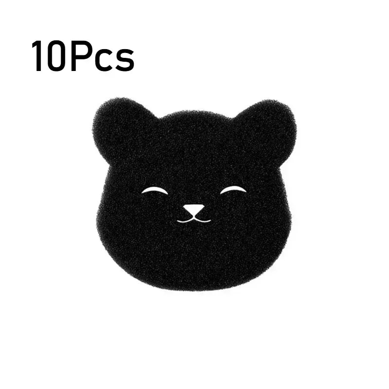 A black, fuzzy cat-shaped pet hair remover sponge.