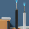 A vertical view of a black and white visual ear cleaning tool with an LED light emitting from the tip.