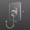 Clear self-adhesive rotating wall hooks with a curved wire for storage.