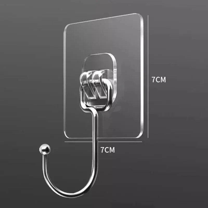 Clear self-adhesive rotating wall hooks with a curved wire for storage.