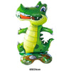 A bright green cartoon dinosaur foil balloon with yellow body and patterned feet.
