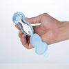 A hand holds a light blue stainless steel tongue scraper with a protective case.