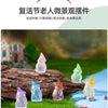 A collection of luminous resin mini fairy gnomes in various pastel colors arranged on green grass.