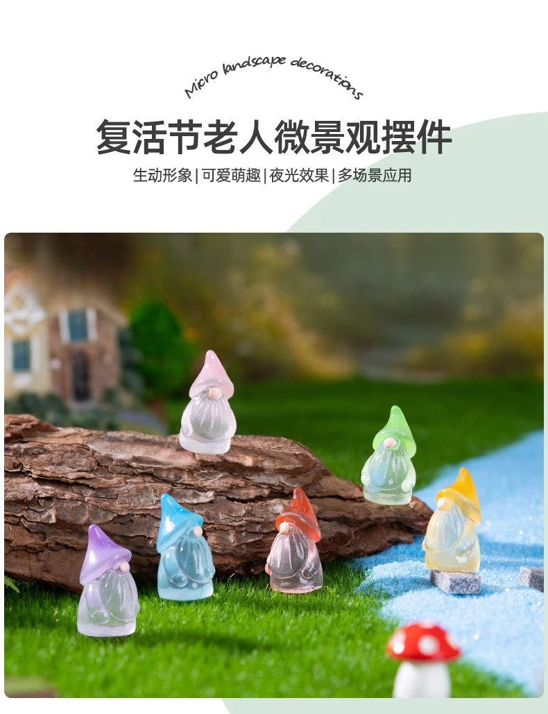 A collection of luminous resin mini fairy gnomes in various pastel colors arranged on green grass.