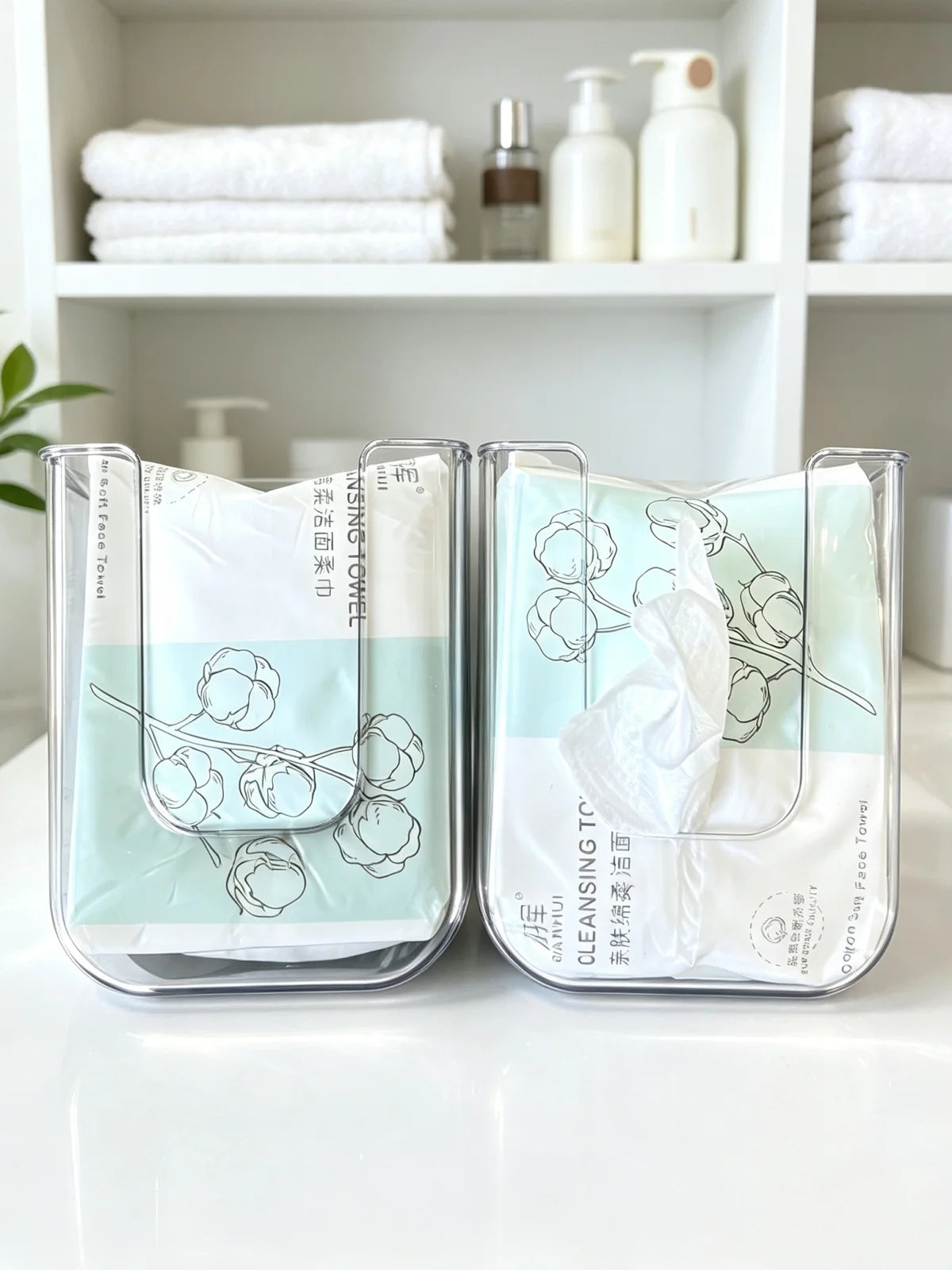 A set of clear plastic containers holding disposable cotton face towels for makeup and cleansing.